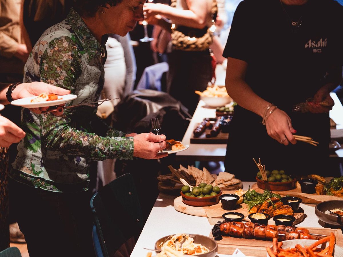 Members sharing food at a city event